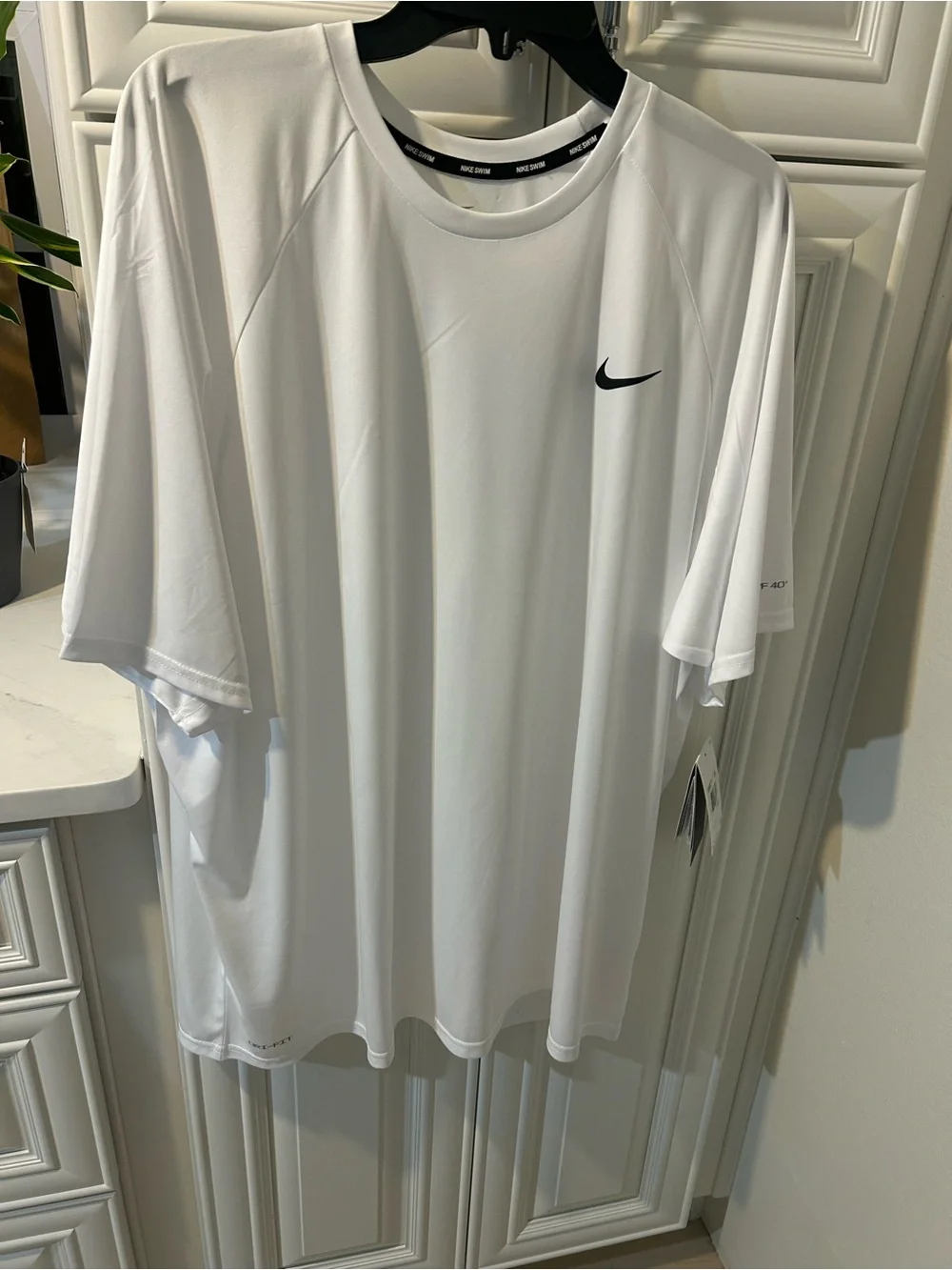 Nike White Short-Sleeve Dri-FIT Athletic Polo Tee with Black Swoosh